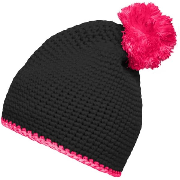 A black knitted hat featuring a vibrant pink pompom and contrast stripe at the base. It has a logo on it.