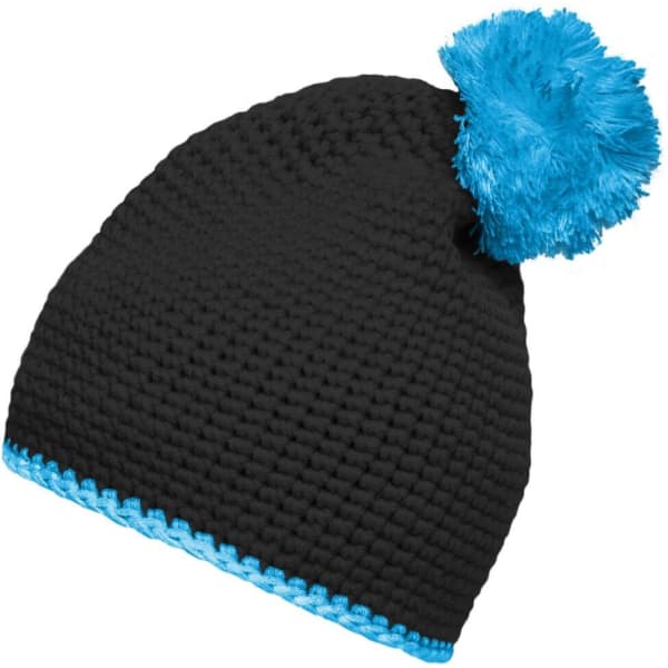 A black knitted pompon hat featuring a bright blue contrast stripe and a fluffy blue pompom on top.