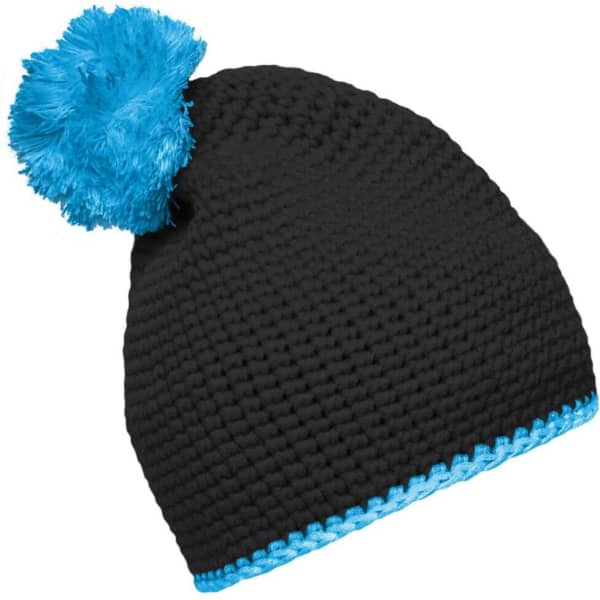 A black knitted pompon hat with a bright blue pompom and contrast blue stripe at the base. It features a logo.