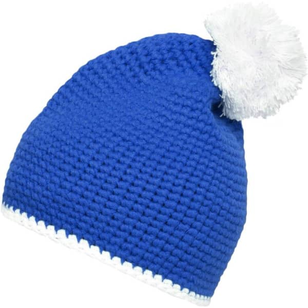 A blue knitted hat with a white pompom and a contrasting white stripe at the base. It features a logo.