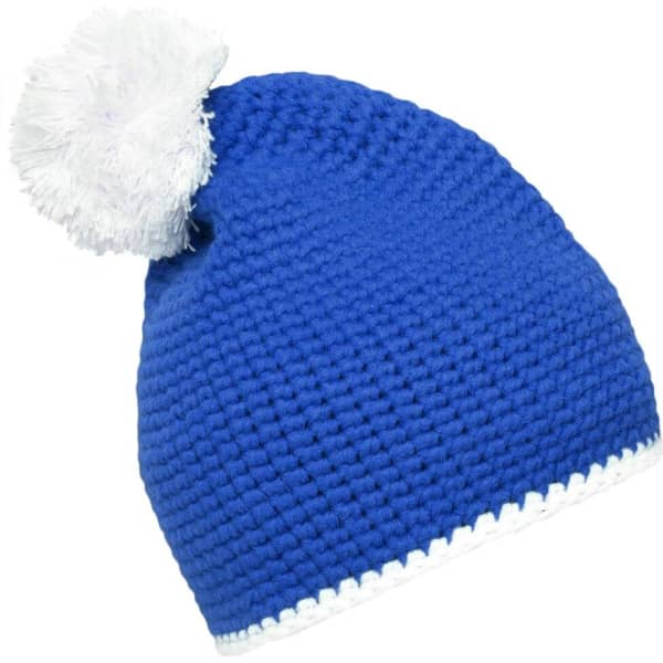 A blue knitted pompon hat with a white contrast stripe and a fluffy pompom on top. It features a logo on the side.