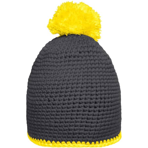 A black knitted beanie with a yellow pompom on top and a yellow contrast stripe at the base.