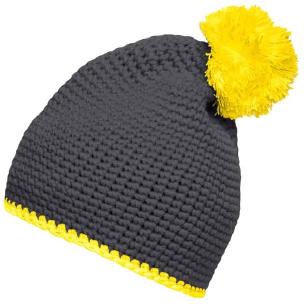 A grey knitted beanie with a bright yellow pompom and contrast stripe at the base. It features a logo.