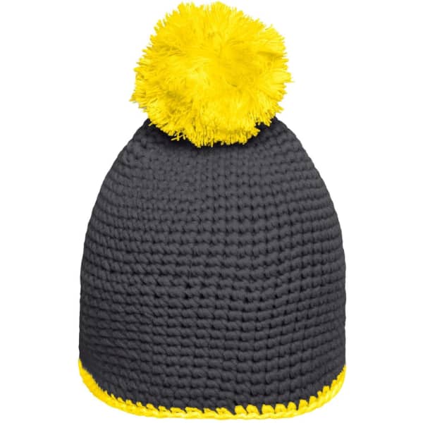 A knitted pompon hat in grey with a bright yellow pompom and contrast stripe at the base.