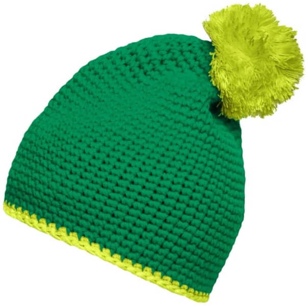 A green knitted hat with a bright yellow pompom and contrast stripe at the base. It features a logo.