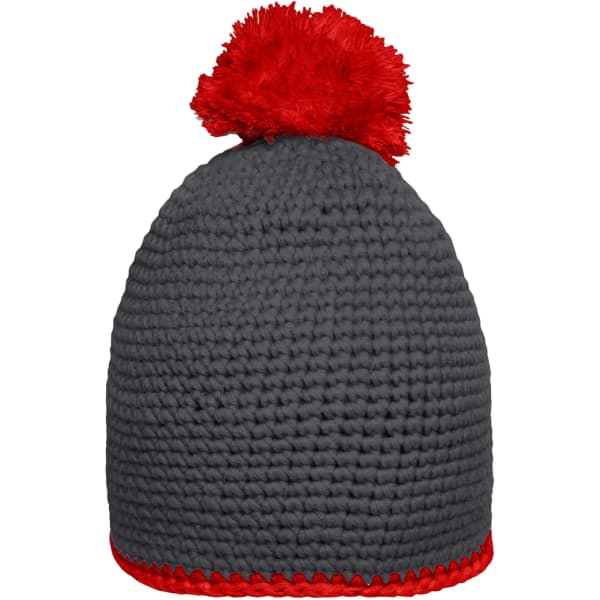 A grey pompon hat with a red contrast stripe and a fluffy red pom-pom on top. Features branding on the side.