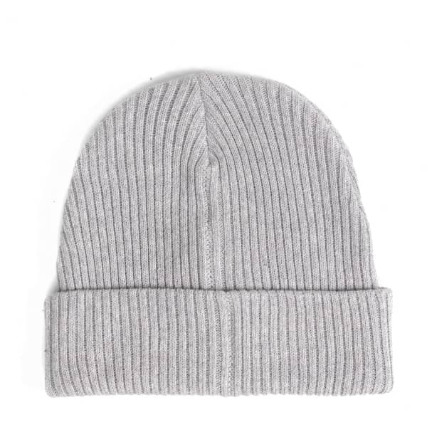 A grey ribbed beanie with a turned-up cuff, featuring a logo on the side.