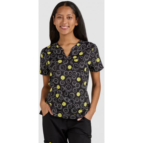 A top featuring a black background with various smiley face patterns in yellow and green, with a logo present.