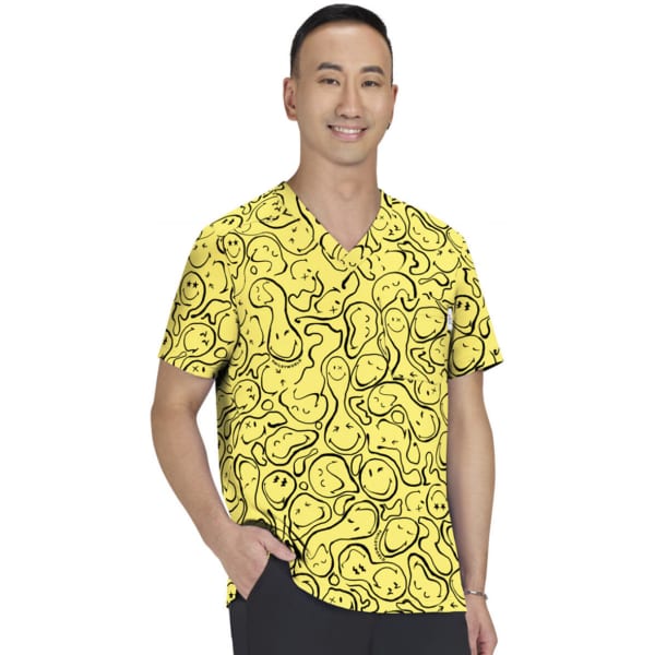 A bright yellow top featuring a playful print with various shapes and lines, worn by a man. It has a logo.