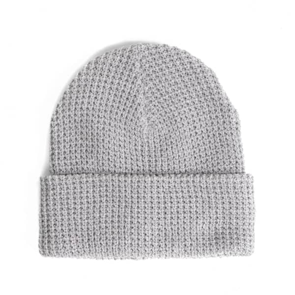 A grey waffle knit beanie with a folded cuff and textured pattern, featuring a small logo.