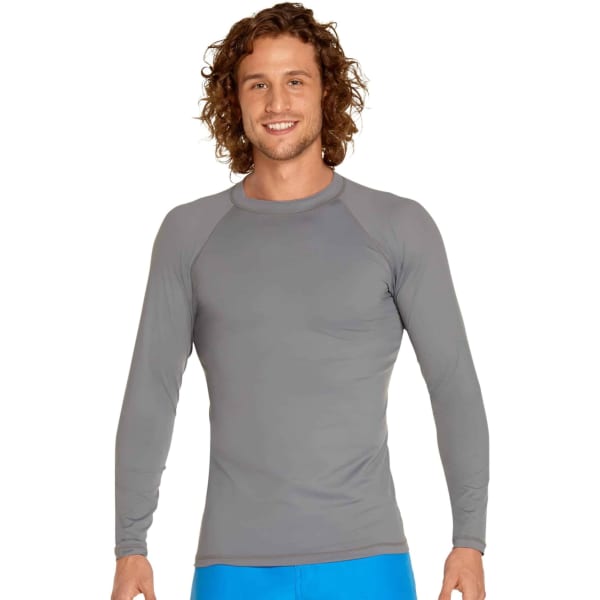 A man wearing a grey long sleeve rashie with a fitted design. The garment features a round neckline and long sleeves.