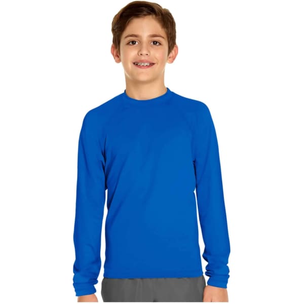 A boy wearing a long sleeve rashie in bright blue, featuring a logo on the garment.