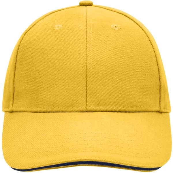 A yellow 6 panel sandwich cap with a rounded crown and a logo on the front.