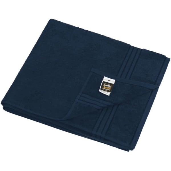 A navy blue sauna sheet folded neatly, featuring a corner tag and textured fabric.