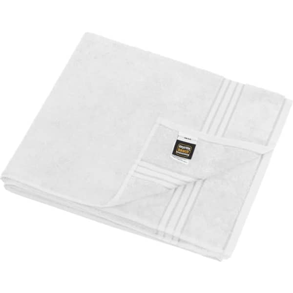 A white sauna sheet folded neatly, featuring a simple design and a small logo on one corner.