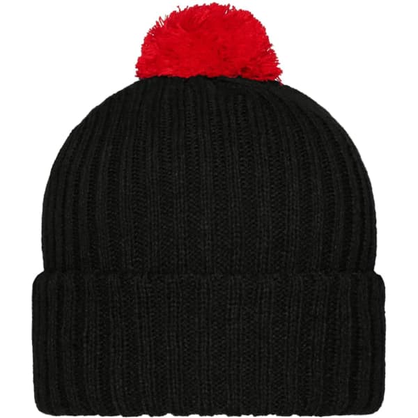 A black knitted cap with a red pompon on top and a ribbed design. The cap has a logo on it.