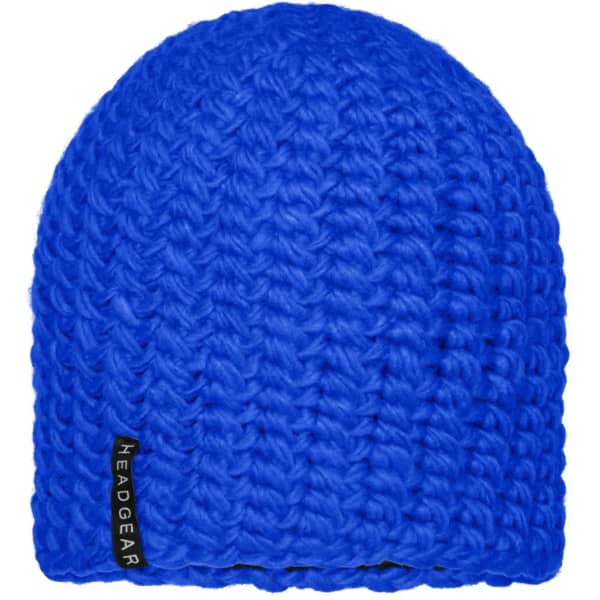 A bright blue crocheted cap featuring a textured design and a small logo tag.