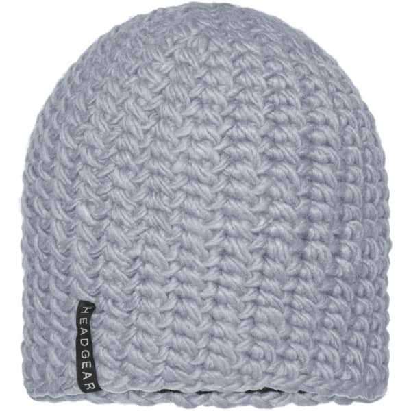 A light grey crocheted cap with a textured design and a small branding label on the side.