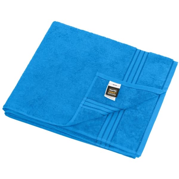 A blue sauna sheet folded neatly, featuring a textured surface and a small logo on the corner.