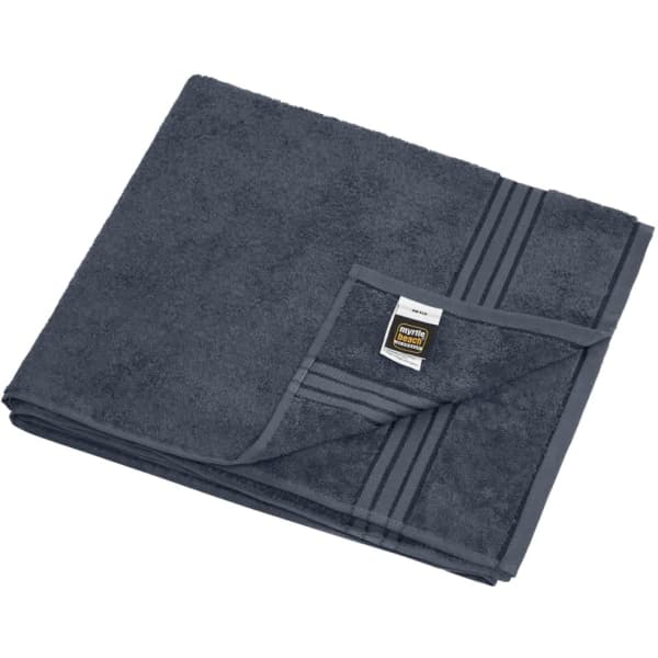 A dark grey sauna sheet folded neatly with a striped edge and a label attached.