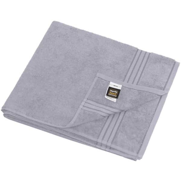 A grey sauna sheet folded neatly, featuring a striped design and a branding label.