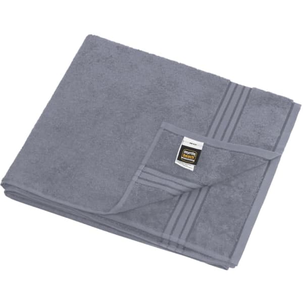A grey sauna sheet folded neatly, featuring a textured surface with a tag and decorative stripe.