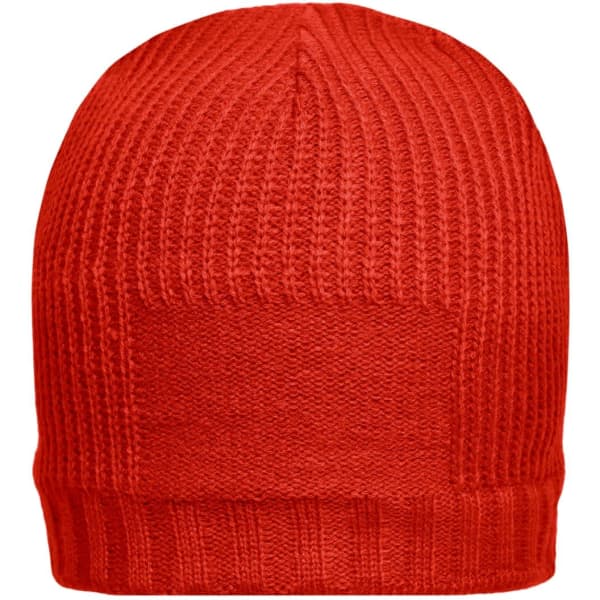 A red beanie featuring a ribbed texture and a logo patch on the side.