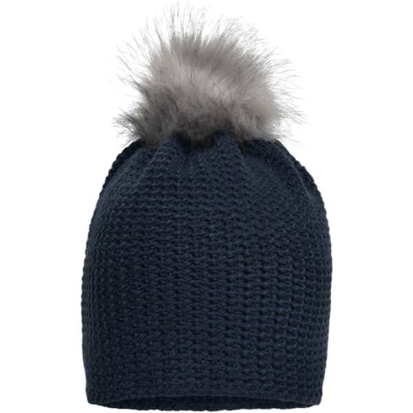 A fine crocheted beanie in navy blue with a grey fur pom-pom on top, featuring a branded logo.