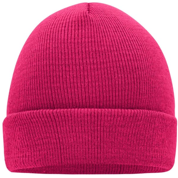 A pink knitted cap with a ribbed texture, featuring a fold-over brim and a simple design.