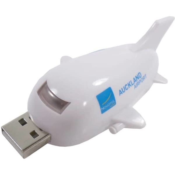 A white aeroplane-shaped flash drive with a USB connector, featuring a logo on one side.
