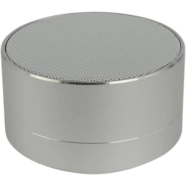 A silver Bluetooth speaker with a round design and a mesh top surface, featuring a sleek metallic finish.