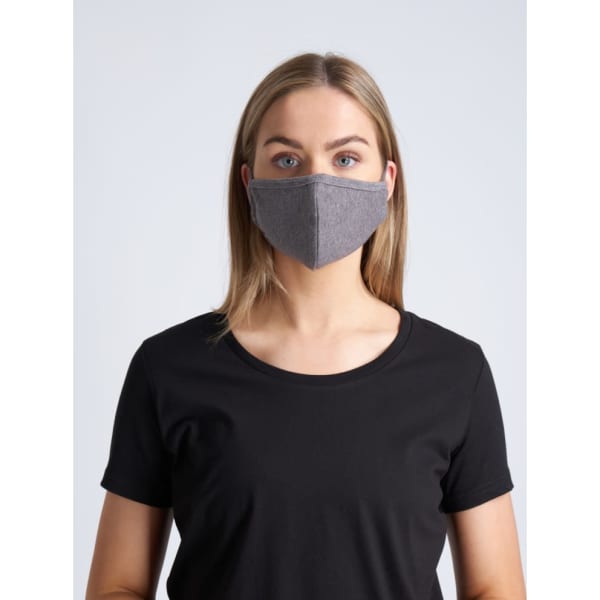 A grey, two-layer face mask is worn by a model with long hair, paired with a black t-shirt.