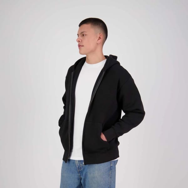 A black zip hoodie with a front pocket, worn by a model standing against a neutral background.