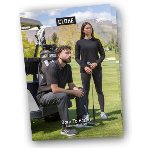 A promotional catalogue with a cover featuring a man sitting and a woman standing on a golf course, showcasing golf apparel.