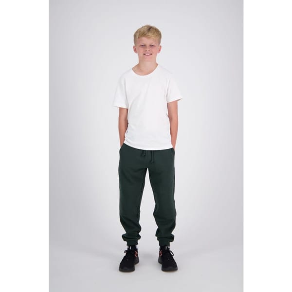 Reinforced knee sweatpants in dark green, modelled by a young boy wearing a white t-shirt and black shoes.