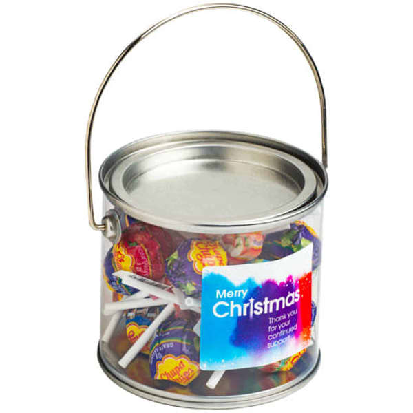 A medium silver PVC bucket filled with colourful lollipops, featuring a handle and a branding label.