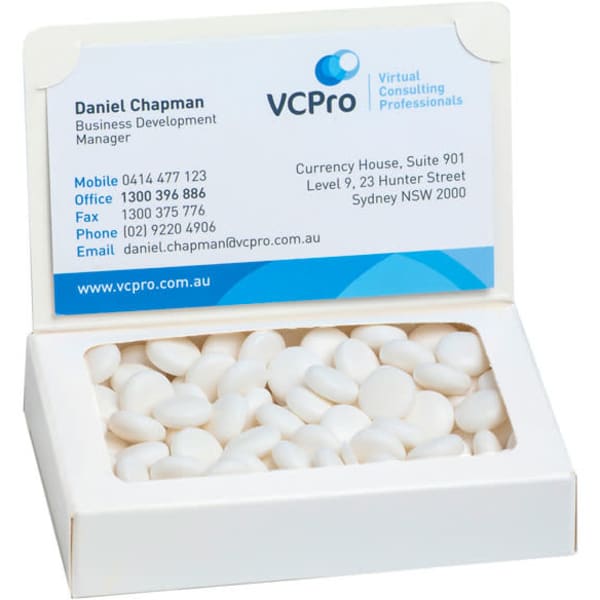 A white box containing mints with a business card inside. The box has a logo.