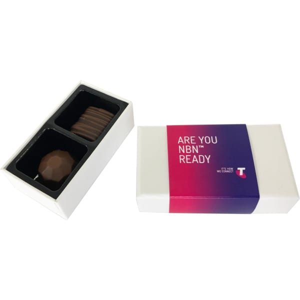 A white box containing two chocolate treats, one with a smooth surface and the other with ridges, featuring a logo.