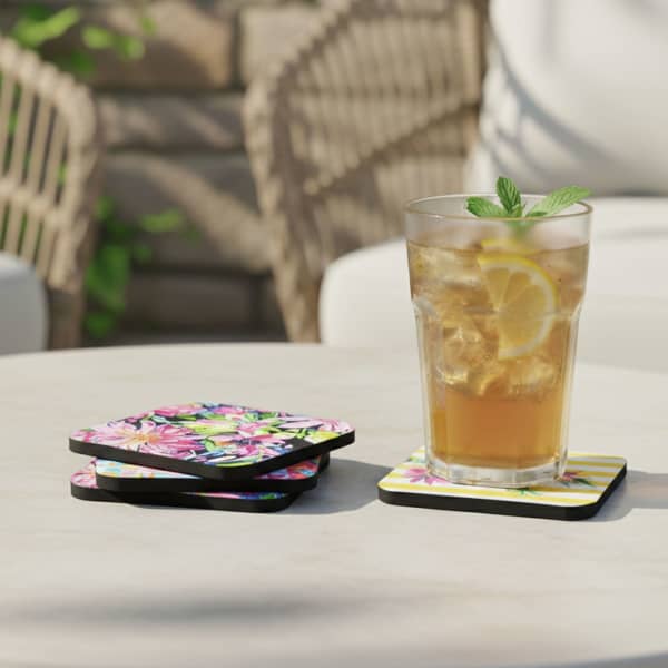 A drink bottle sits on a floral-patterned 5mm neoprene coaster, with additional coasters nearby on a table.