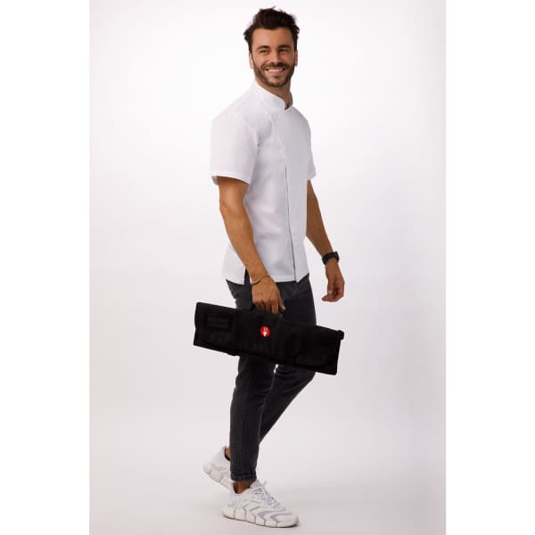 A man in a white shirt holds a black knife wrap bag featuring multiple pockets. The bag has a logo.
