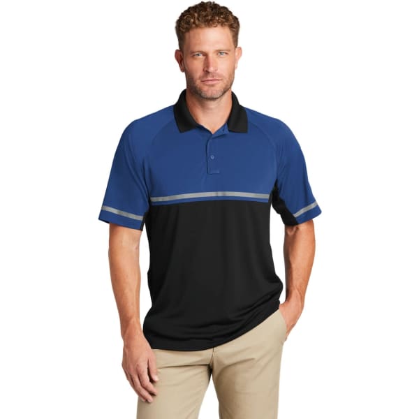 A man wearing a blue and black polo shirt with reflective stripes and a logo, suitable for workwear.