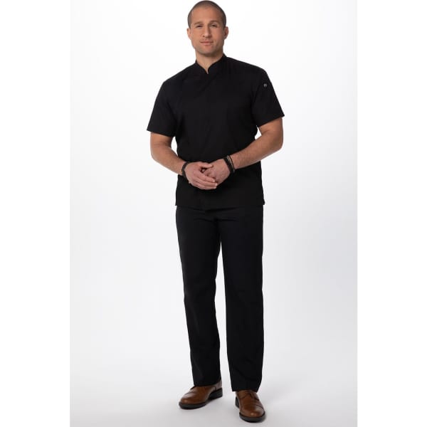 A chef jacket in black with short sleeves, paired with matching black pants and brown shoes. It features a logo.