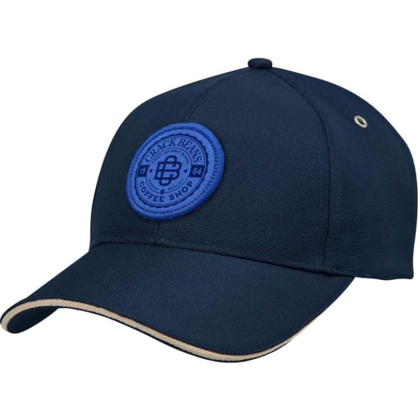 A navy cap with a round blue logo patch and a cream-coloured brim. Features include a structured design.