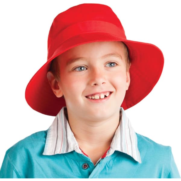 A red kids' twill bucket hat with toggle featured on a smiling child wearing a collared shirt.
