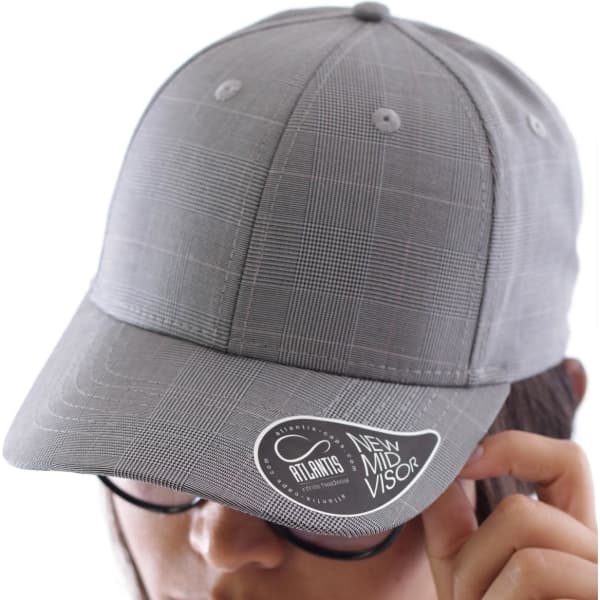 A grey cap with a checkered pattern, featuring a branded tag on the visor.