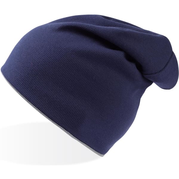 A navy blue beanie with a slouchy fit and a logo on the side.