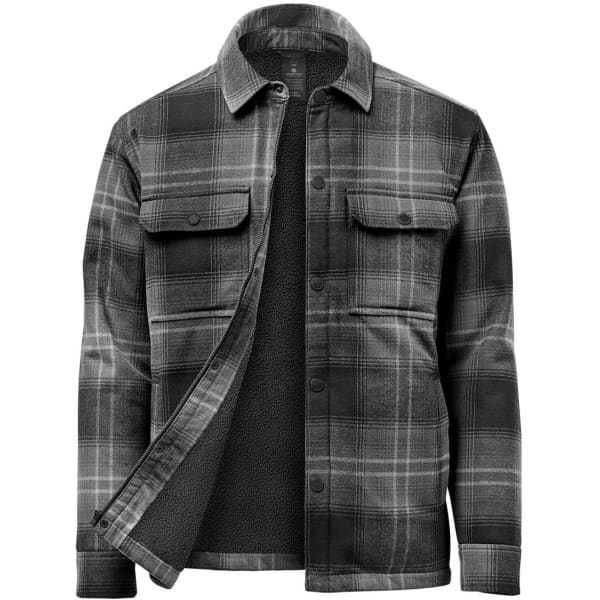 A men's plaid jacket in black and grey, featuring a Sherpa lining and two front pockets. It has a logo on it.