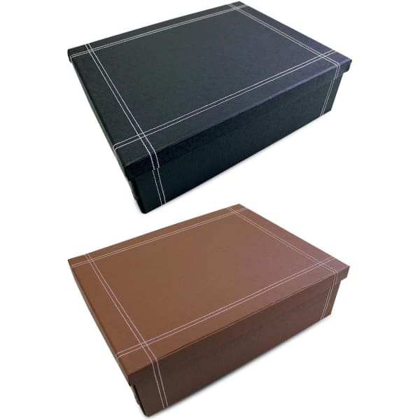 A small keepsake box in black and brown, featuring contrasting stitching and a simple design. It includes a logo.