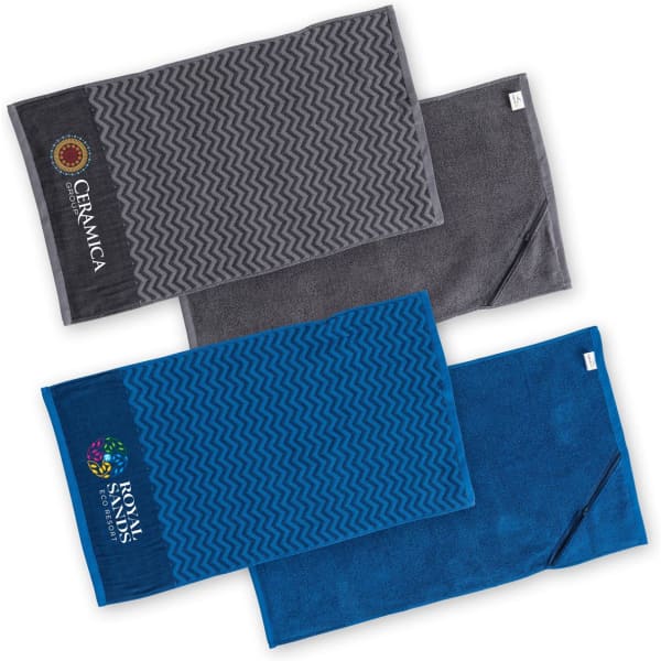 Three gym towels in grey and blue, featuring different textured patterns and branding.