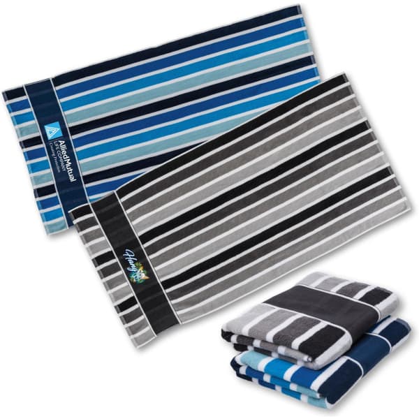 A set of striped towels in shades of blue, grey, and black, featuring a logo on one towel.